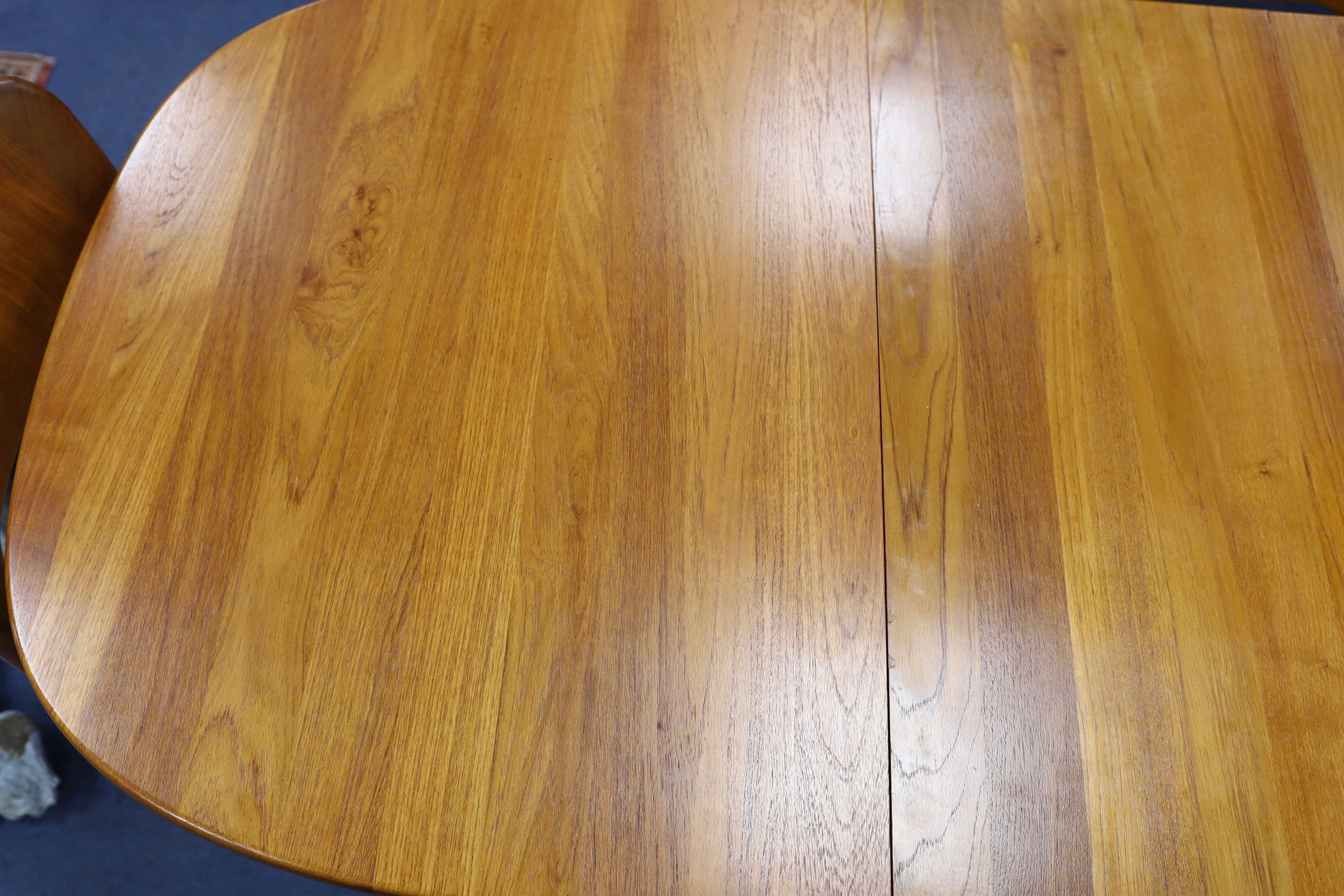 Mid century design. A Niels Koeford Danish teak extending dining table and four chairs, 222cm extended, width 89cm, height 73cm